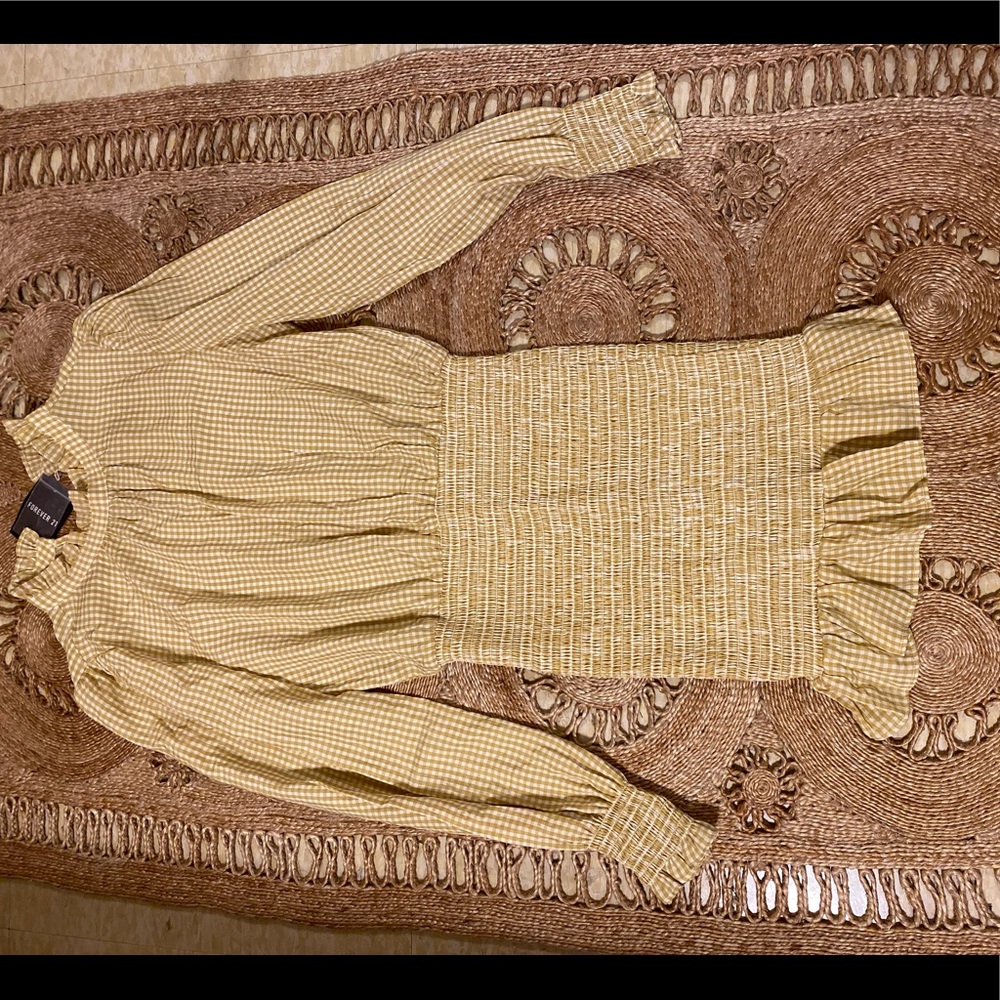 White and yellow checkered dress with rouging on lower half
